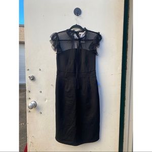 Size small Crimson in Grasse black dress with lacy tie neck.